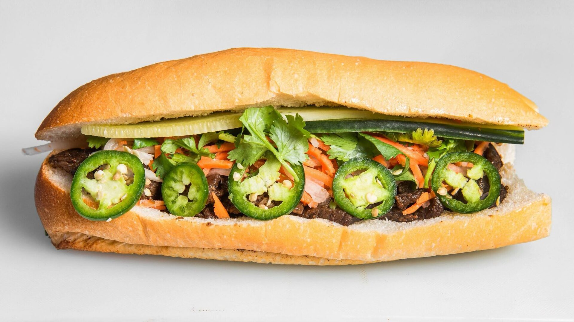 House Bánh Mì with jalapeño, cilantro, cucumber and pickled carrot