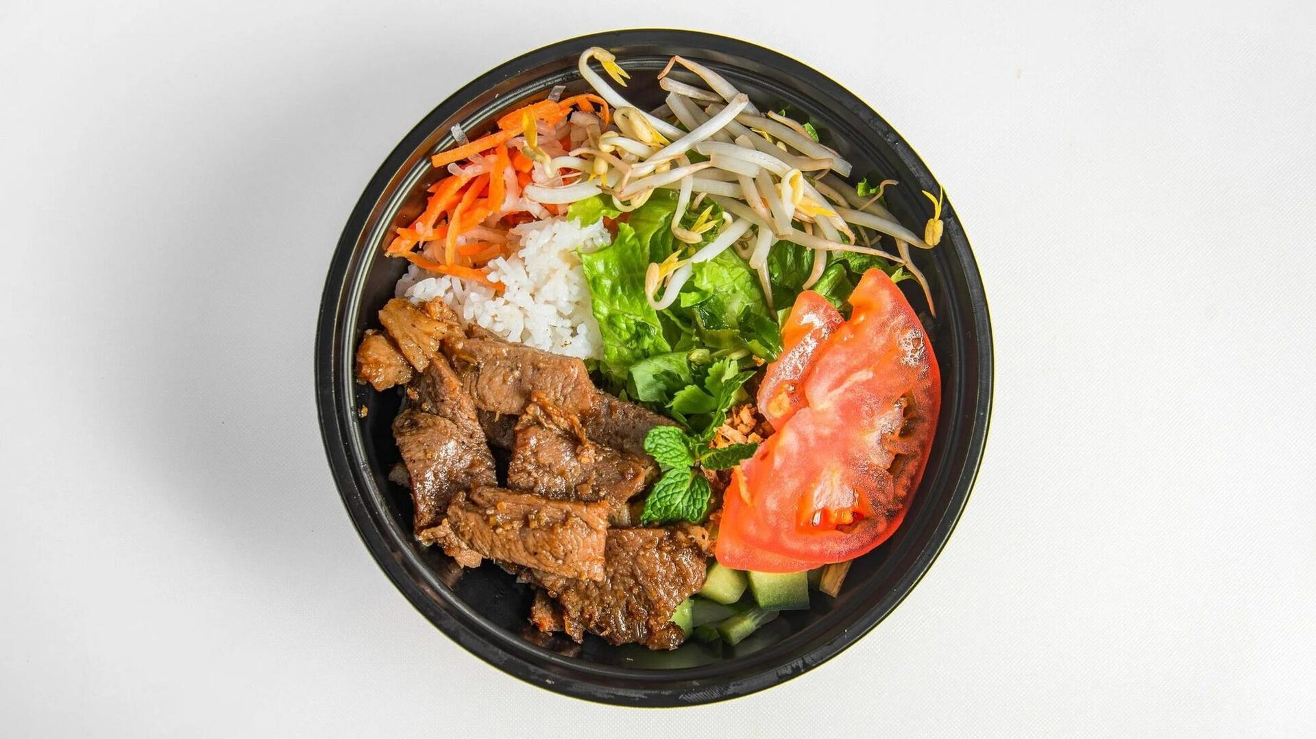 House Rice Bowl (Cơm Thịt Nướng) with grilled meat, jasmine rice and fresh vegetables