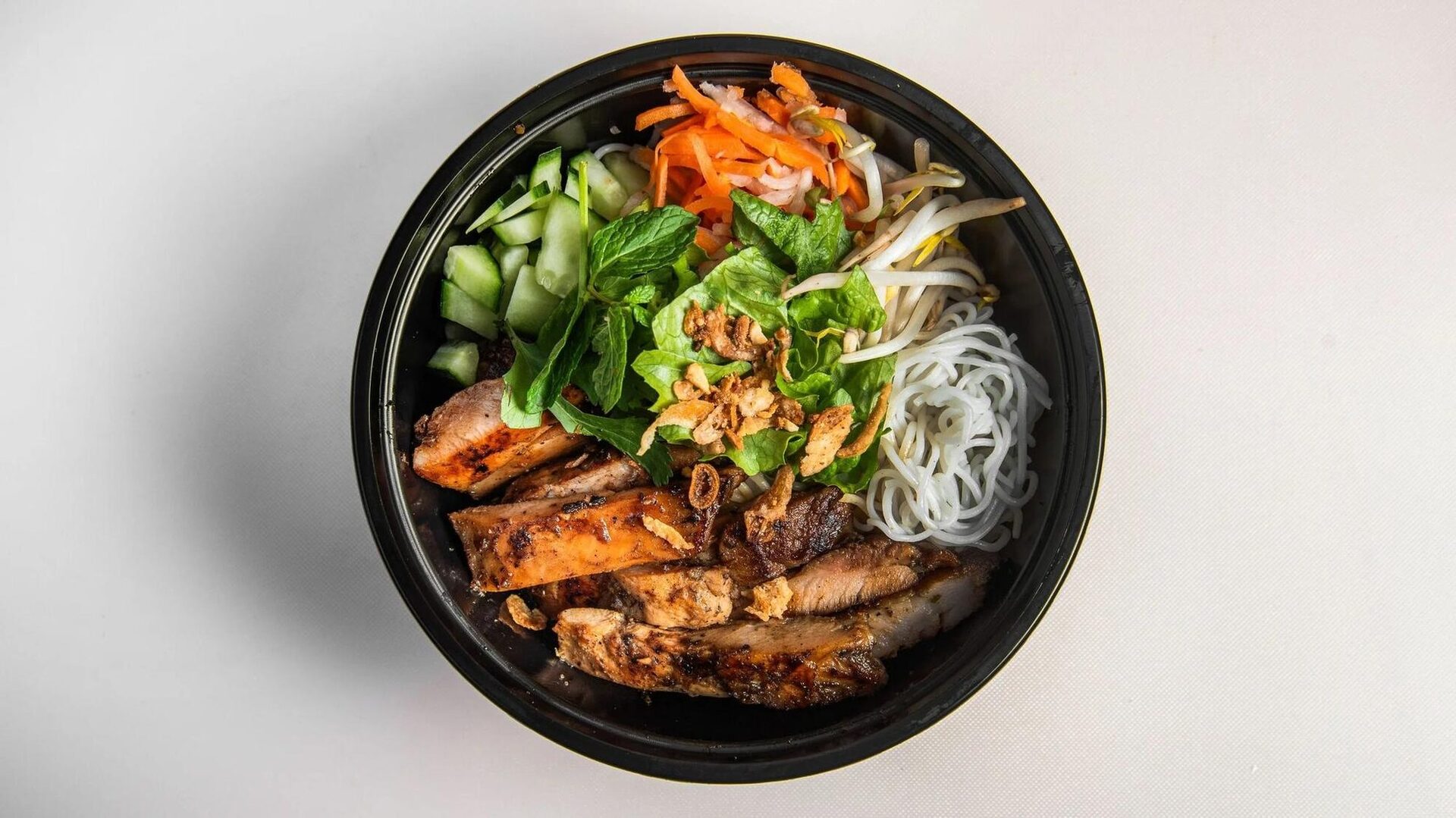 House Noodle Bowl (Bún Thịt Nướng) with vermicelli, grilled meat and herbs