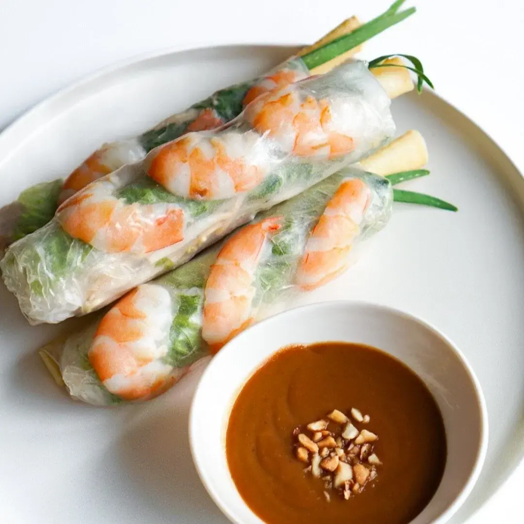 House spring rolls (Gỏi Cuốn) with shrimp and peanut sauce on a white plate