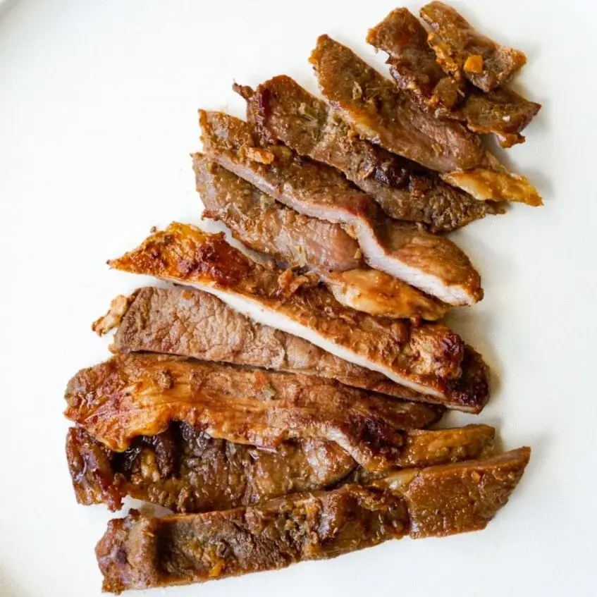 Lemongrass pork in a white dish, from above