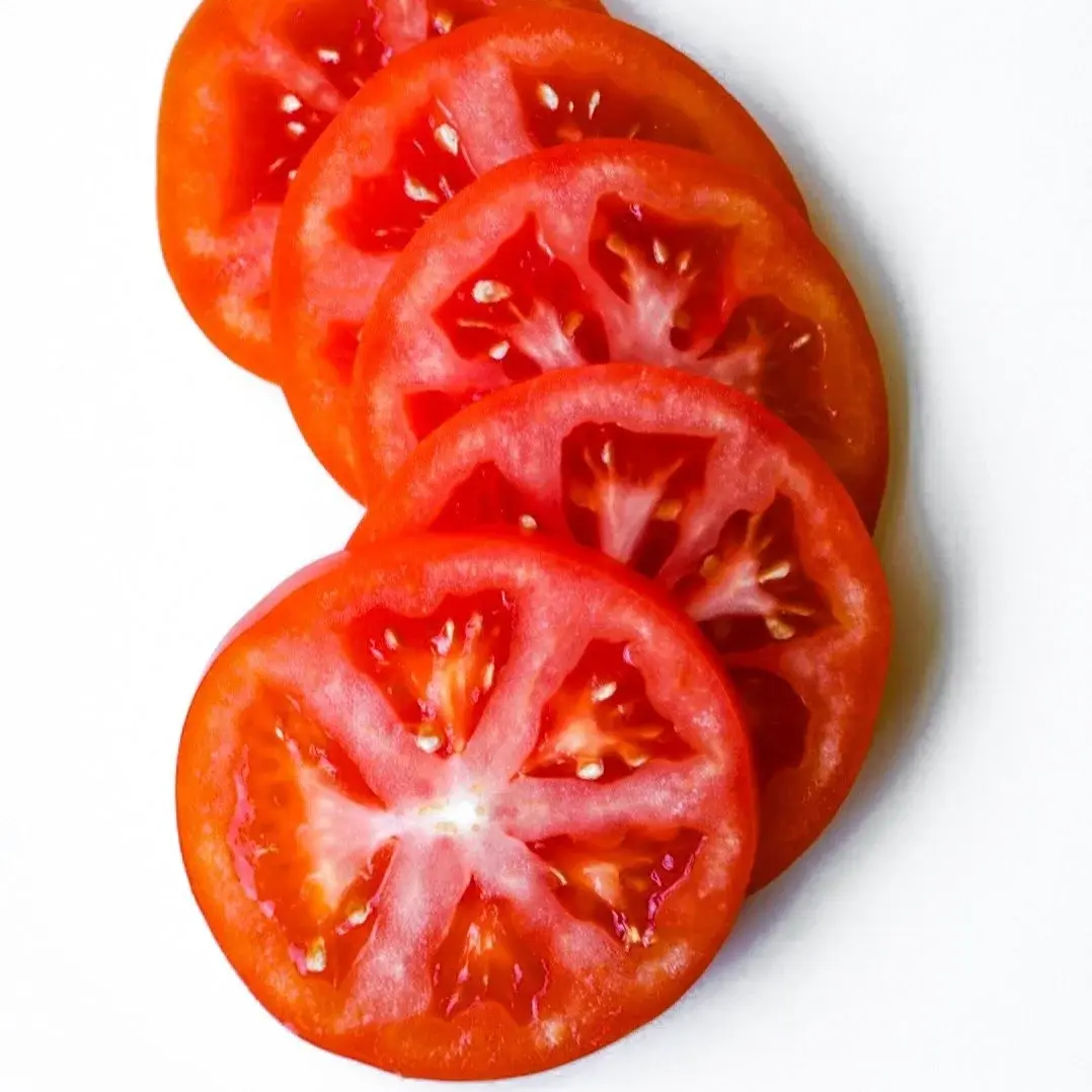 Tomato in a white dish, from above