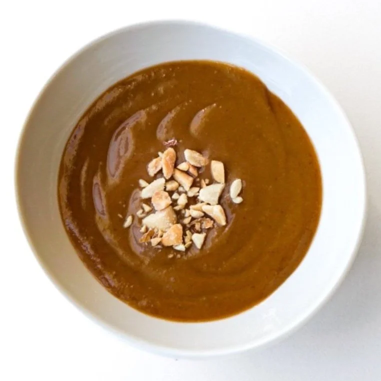 Peanut sauce in a white dish, from above