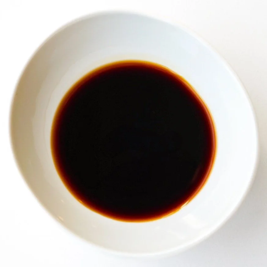 Tangy soy sauce, from above in a white dish