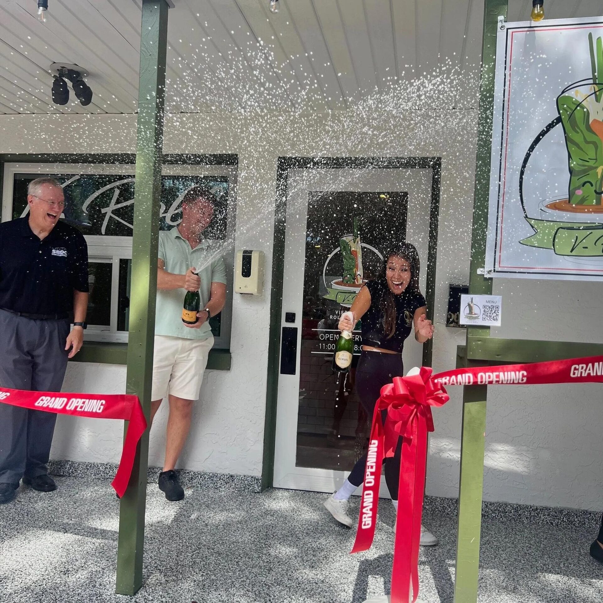 Cutting the ribbon at V-Roll's front door